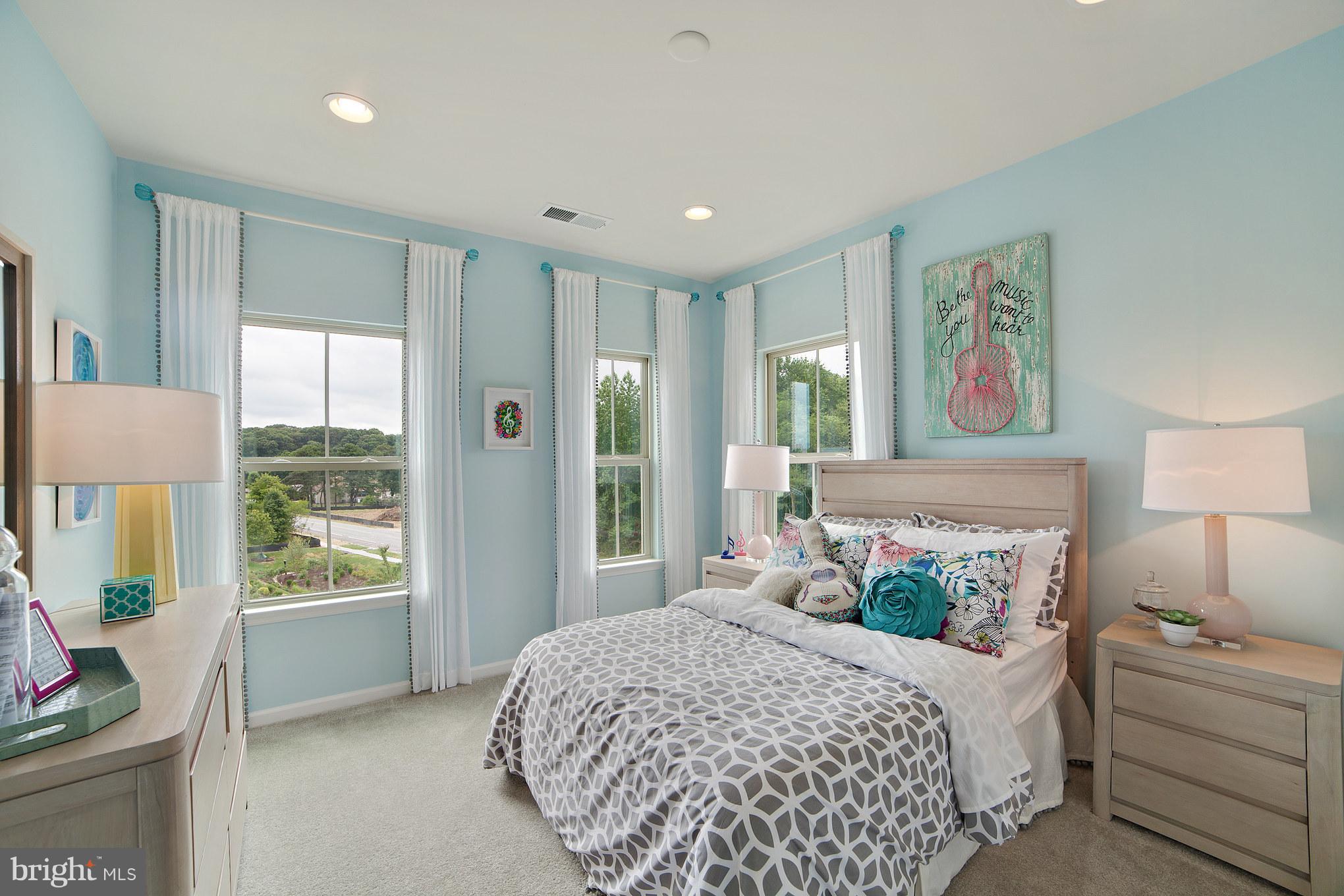 8283 Kippis Road Millersville, MD 21108 - Photo 19 of 28 a bedroom with a large bed and a window