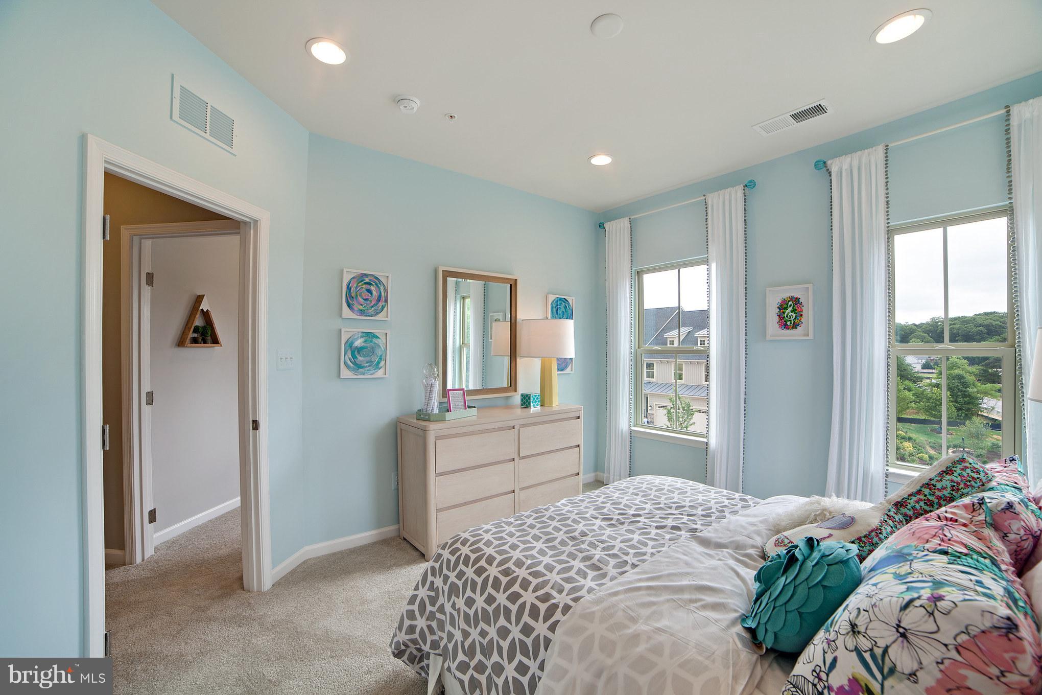 8283 Kippis Road Millersville, MD 21108 - Photo 20 of 28 a bedroom with a bed and a large window