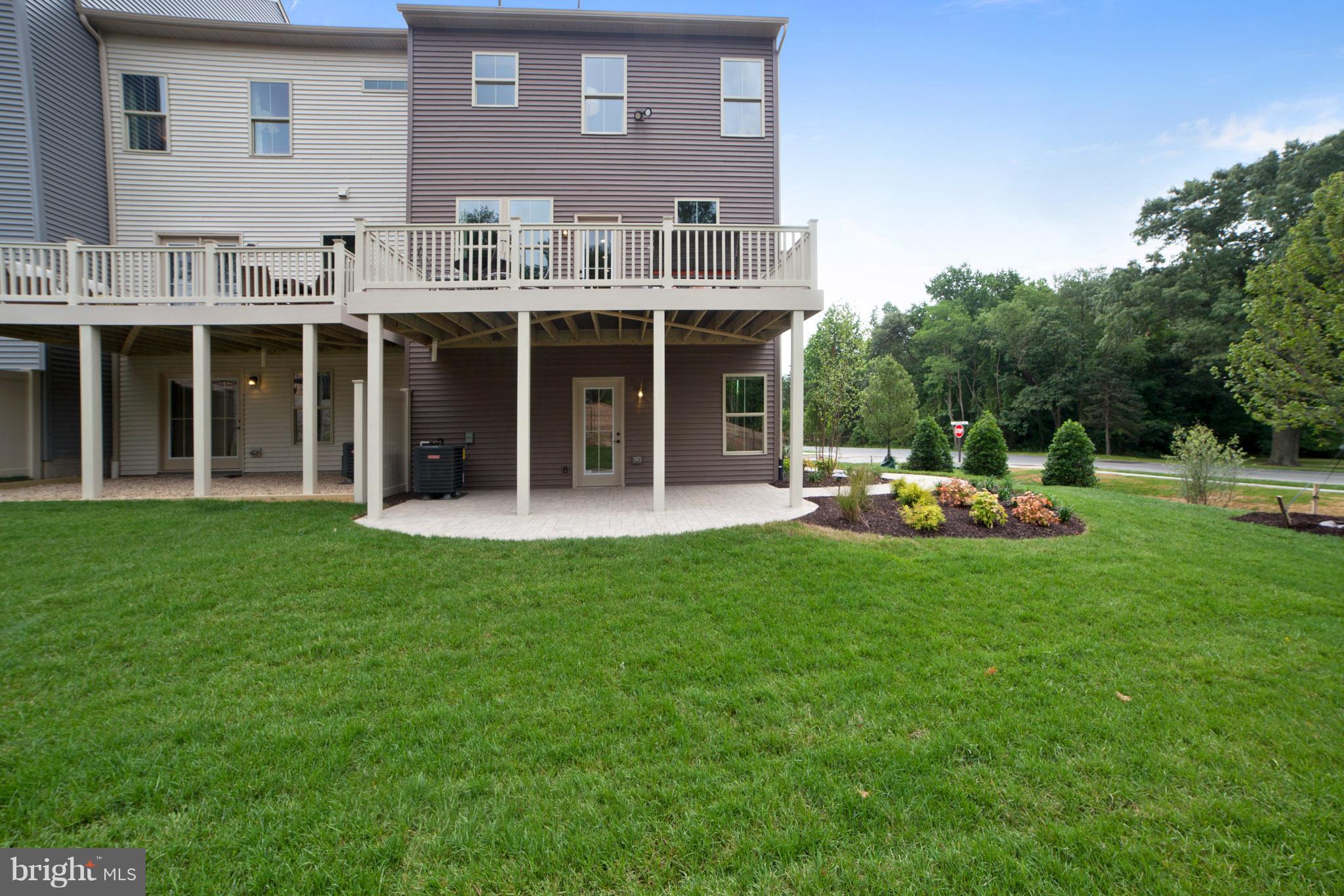 8283 Kippis Road Millersville, MD 21108 - Photo 25 of 28 a view of a house with backyard porch and sitting area