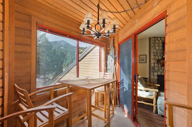 a view of a balcony with furniture and wooden deck