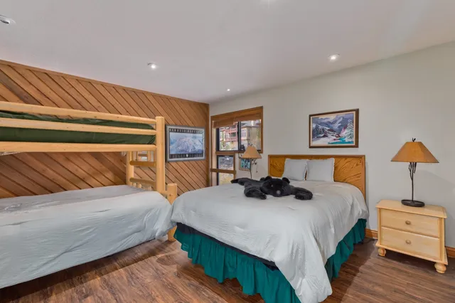 a bedroom with a bed and lamp