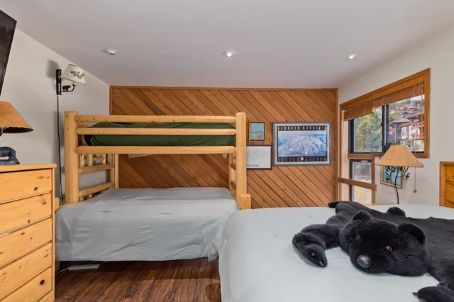 a living room with a large bed and a large window