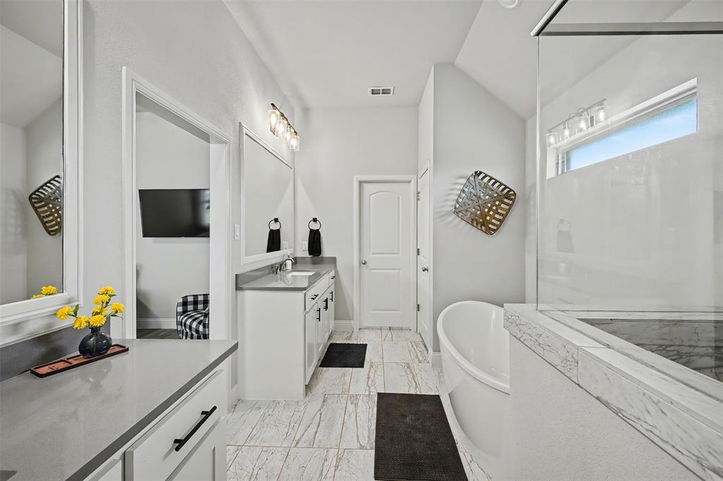 6334 Rustic Edge Street Godley, TX 76044 - Photo 14 of 26 a living room with furniture and a flat screen tv