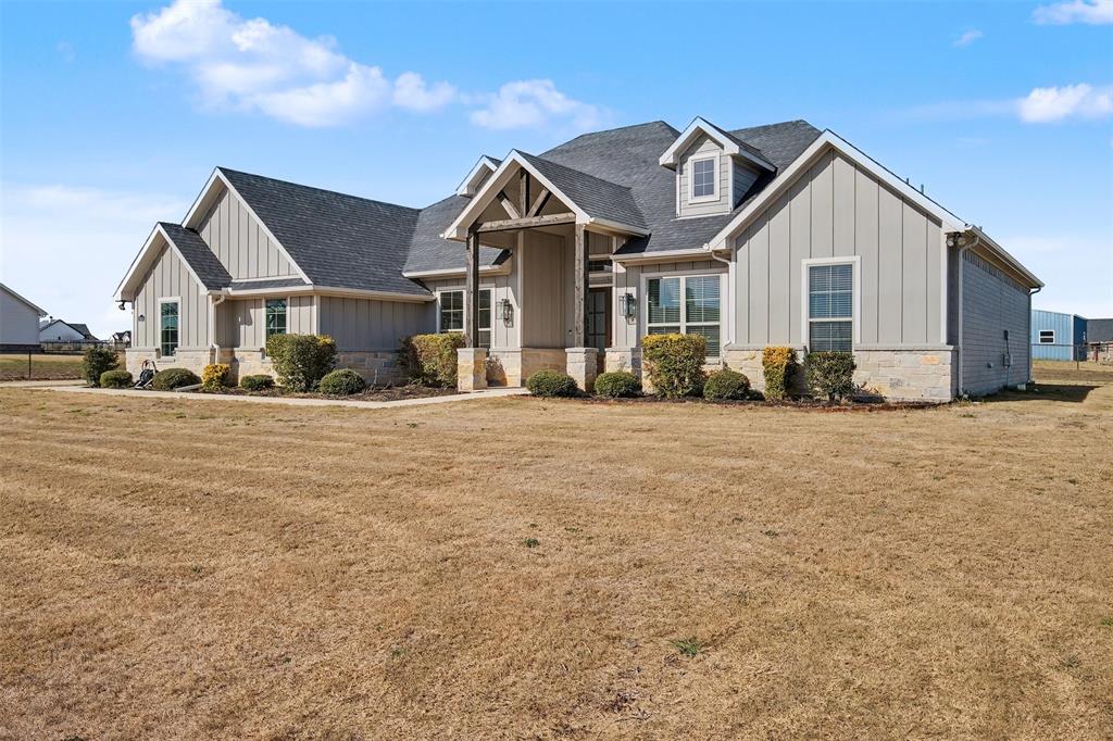 6334 Rustic Edge Street Godley, TX 76044 - Photo 2 of 26 a front view of a house with a yard
