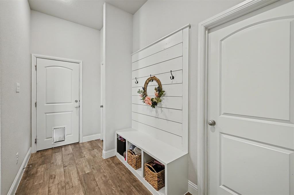 6334 Rustic Edge Street Godley, TX 76044 - Photo 21 of 26 a view of a hallway with wooden floor