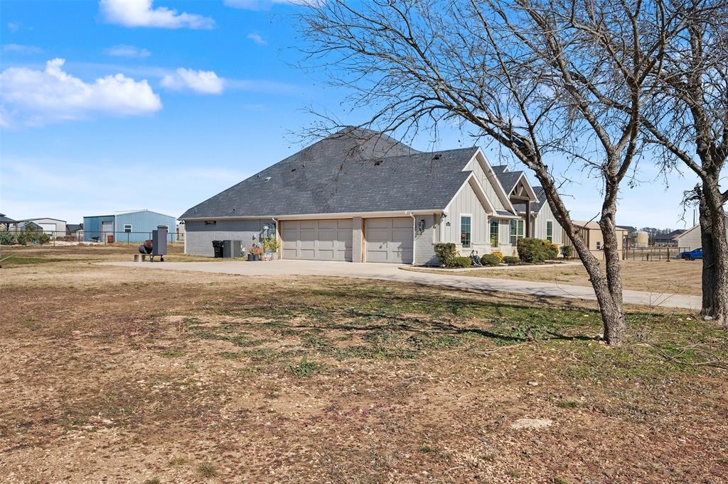 6334 Rustic Edge Street Godley, TX 76044 - Photo 25 of 26 a house with yard in front of it