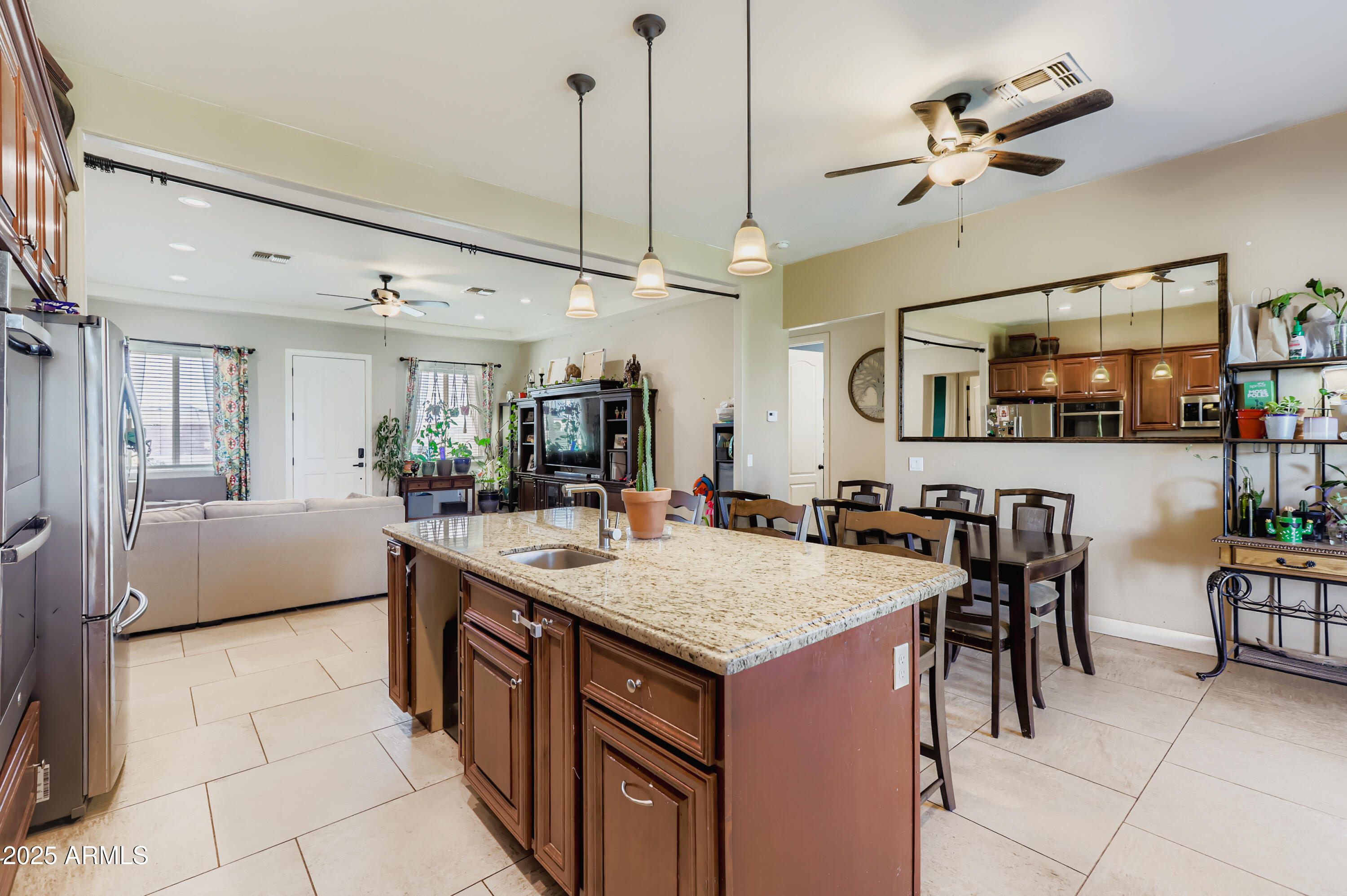 22136 West Gambit Trail Wittmann, AZ 85361 - Photo 12 of 38 a large kitchen with a table and chairs