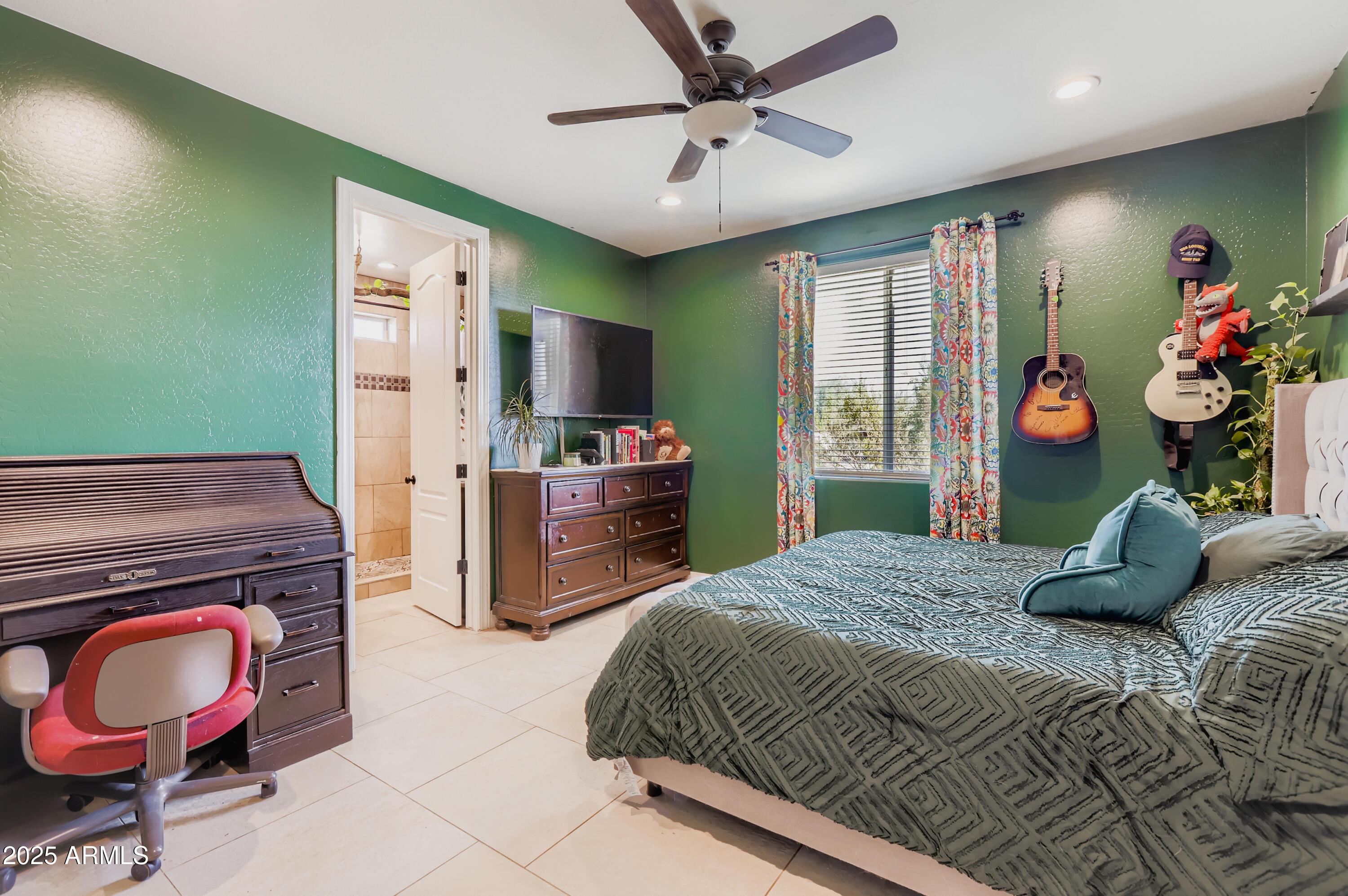 22136 West Gambit Trail Wittmann, AZ 85361 - Photo 14 of 38 a bedroom with a bed and dresser with mirror