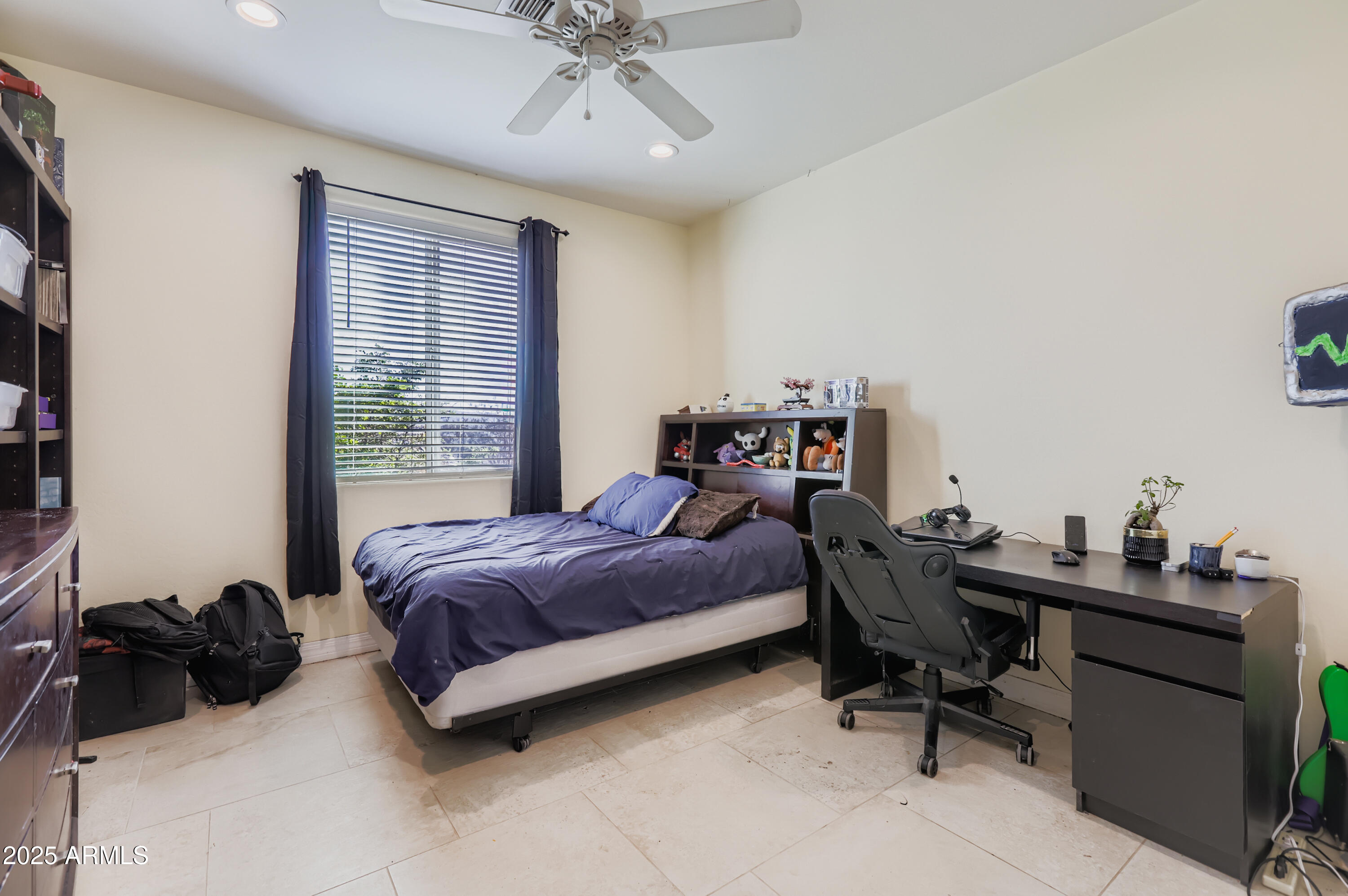 22136 West Gambit Trail Wittmann, AZ 85361 - Photo 21 of 38 a bedroom with a bed and a desk