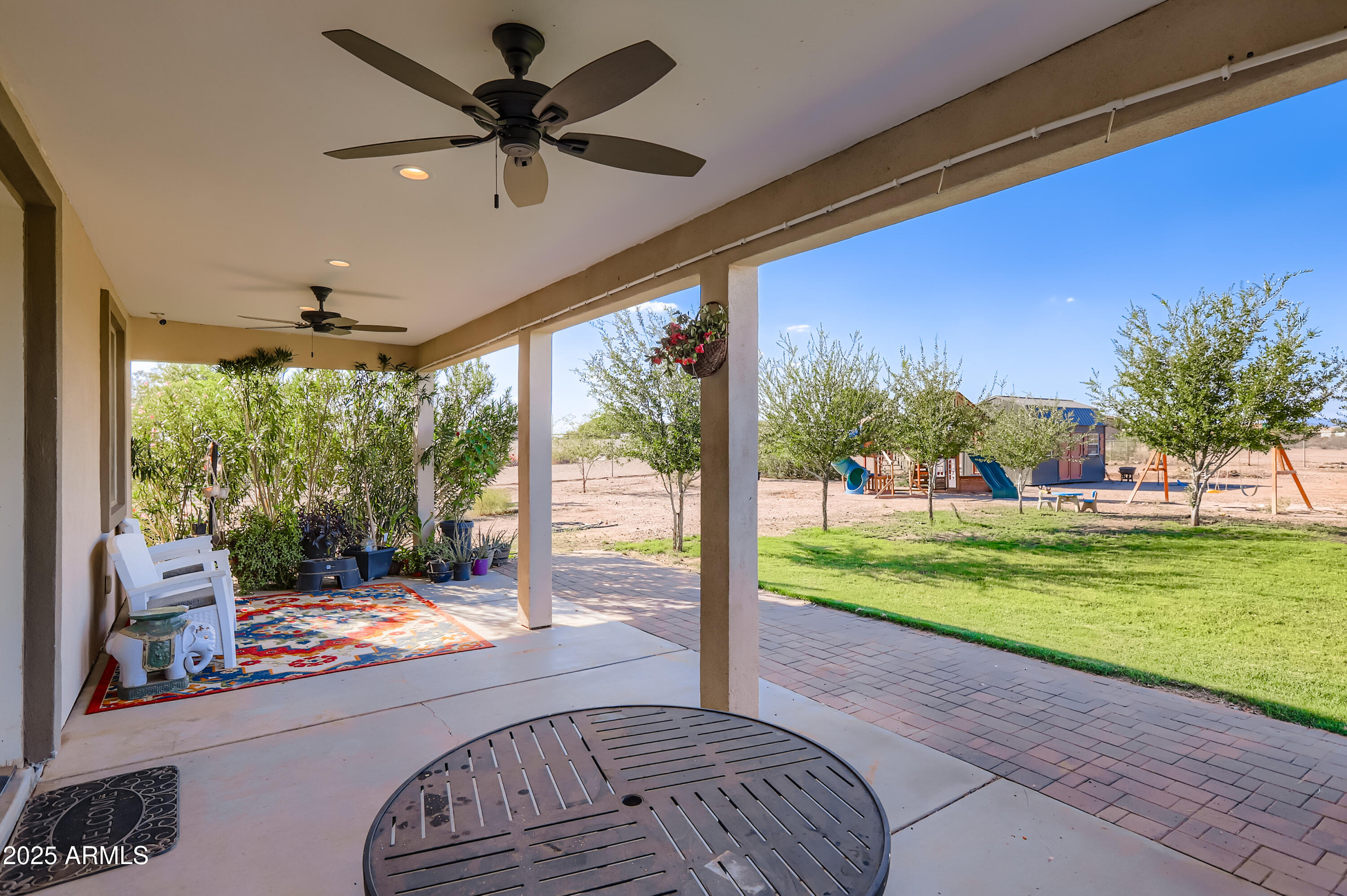 22136 West Gambit Trail Wittmann, AZ 85361 - Photo 23 of 38 a view of a porch and garden