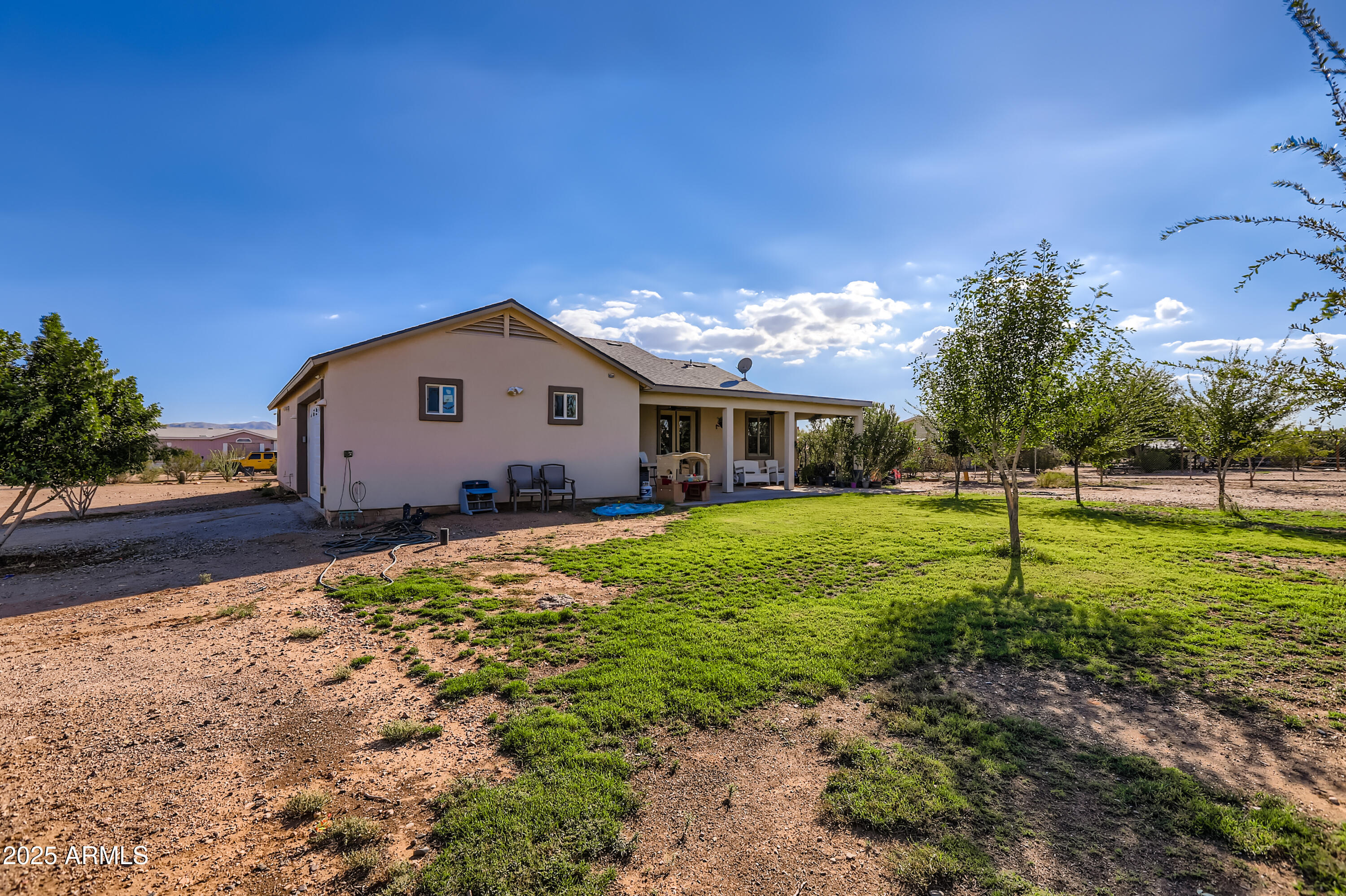 22136 West Gambit Trail Wittmann, AZ 85361 - Photo 28 of 38 a view of house with backyard