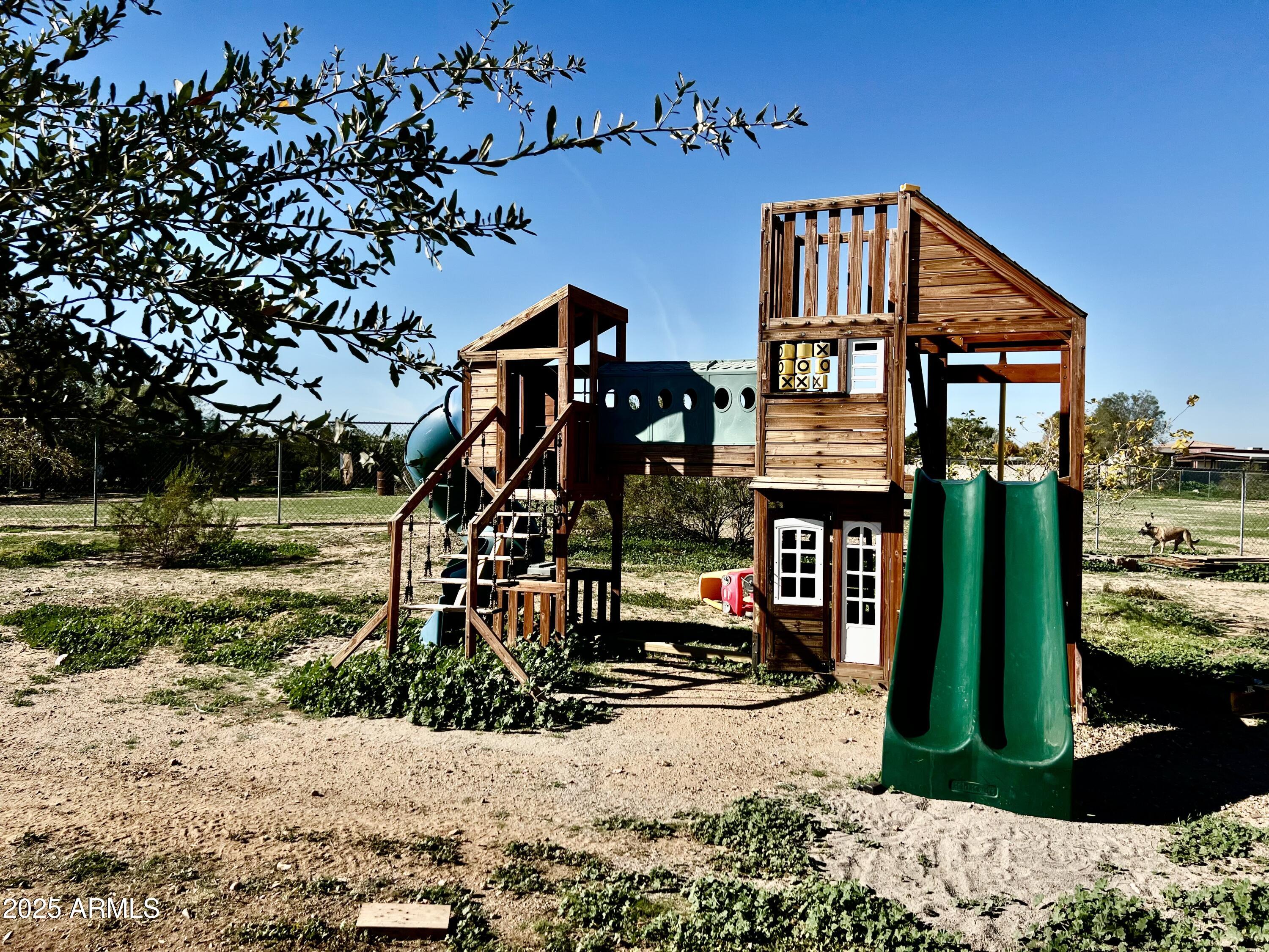 22136 West Gambit Trail Wittmann, AZ 85361 - Photo 30 of 38 a front view of a house with garden