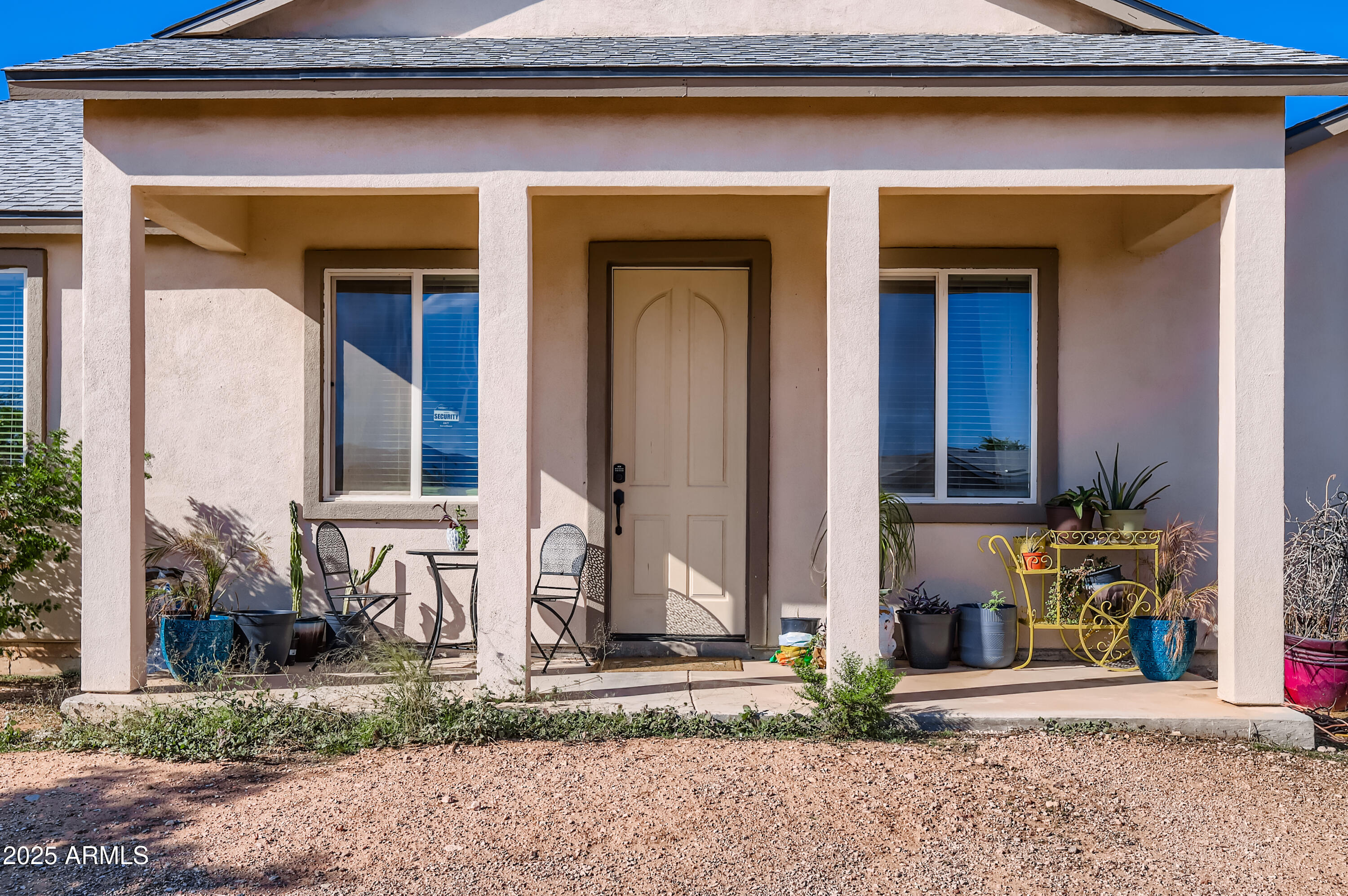22136 West Gambit Trail Wittmann, AZ 85361 - Photo 3 of 38 a front view of a house with garden