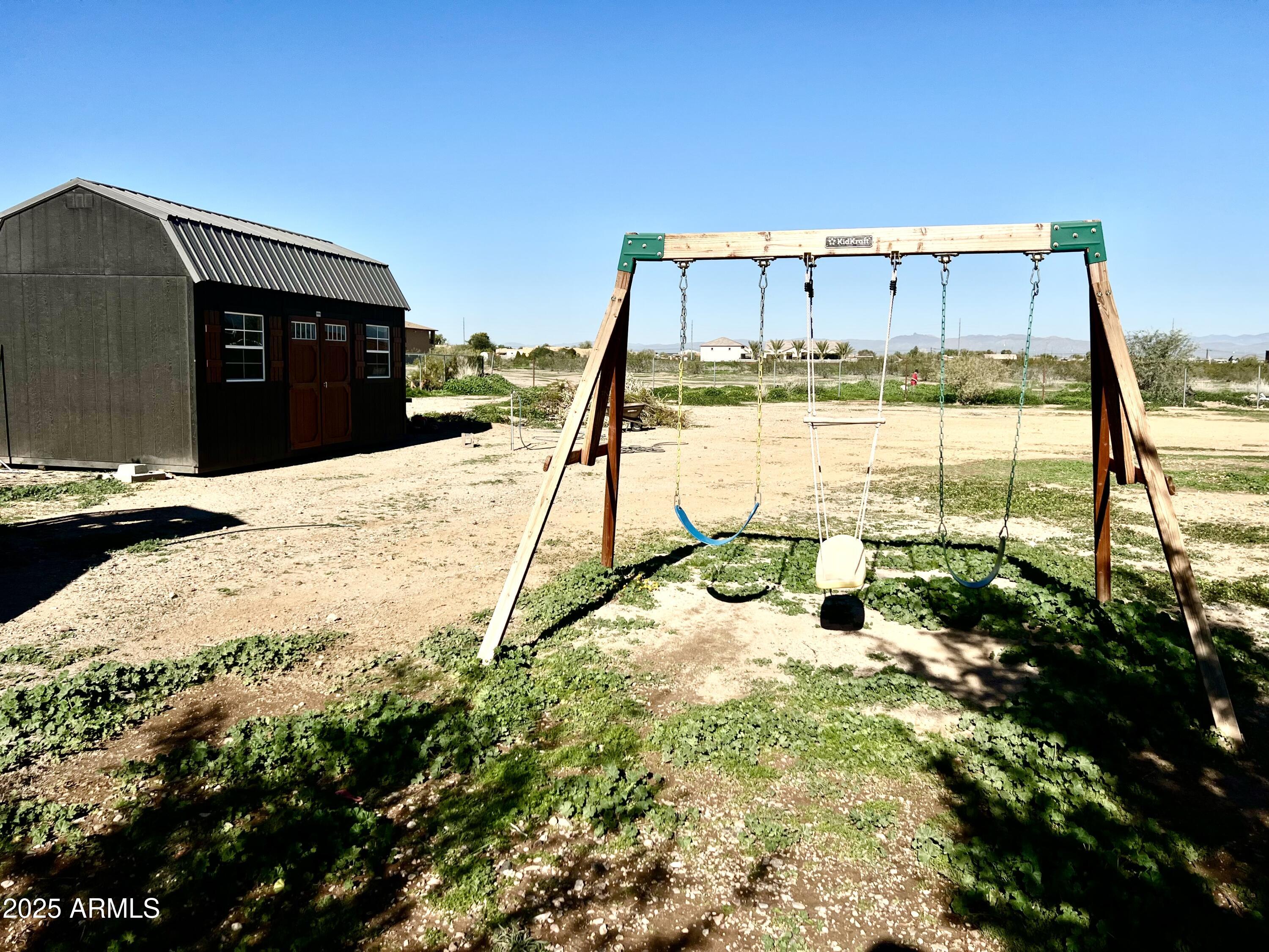 22136 West Gambit Trail Wittmann, AZ 85361 - Photo 31 of 38 a view of a swimming pool with a chair