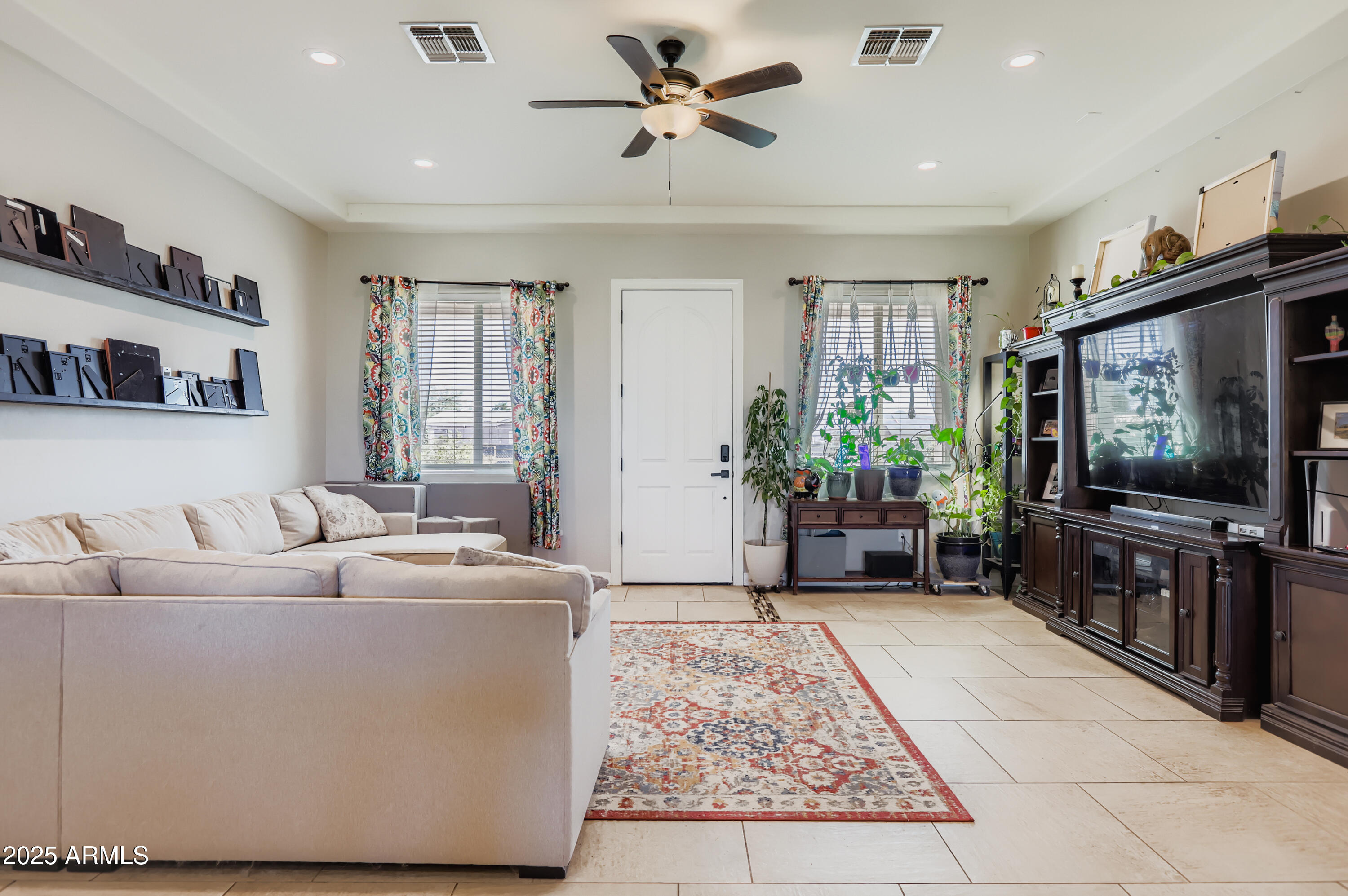 22136 West Gambit Trail Wittmann, AZ 85361 - Photo 6 of 38 a living room with furniture and a flat screen tv