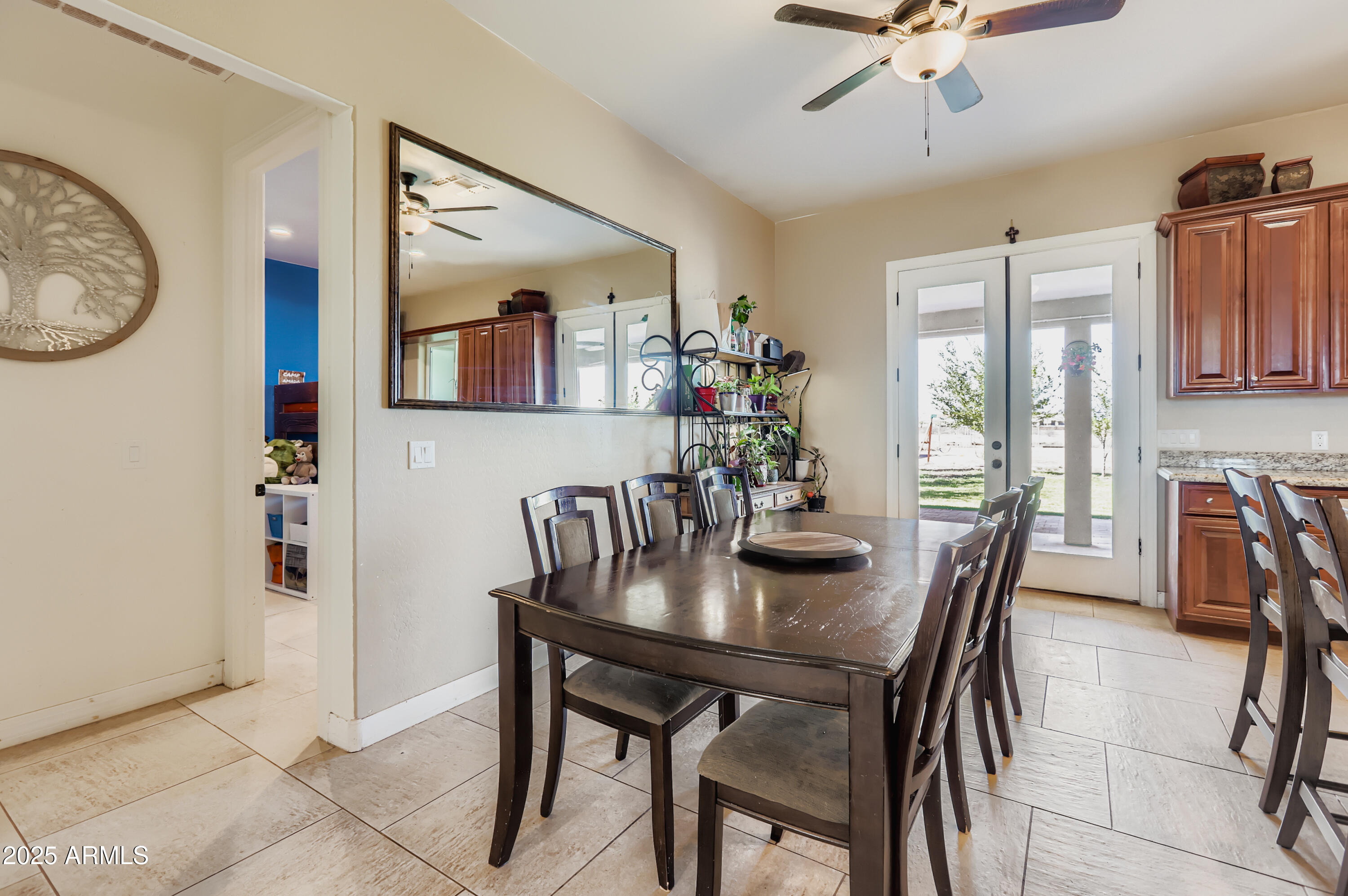 22136 West Gambit Trail Wittmann, AZ 85361 - Photo 8 of 38 a view of a dining room with furniture and chandelier