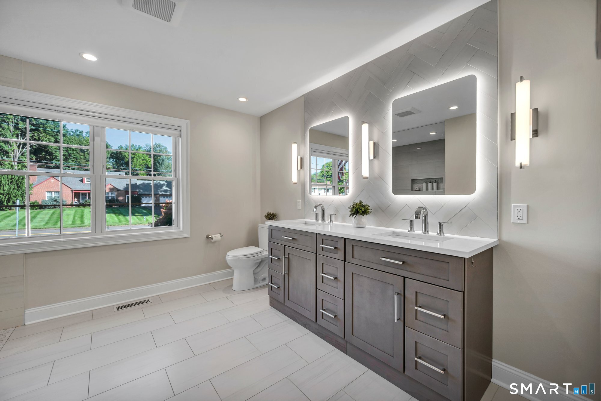 11 Grimes Road Rocky Hill, CT 06067 - Photo 16 of 40 Primary beautifully remodeled bathroom on main level. Double vanity and sinks, In-floor radiant heating!