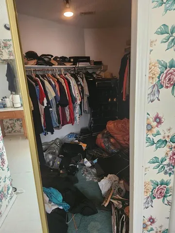 a living room with furniture a piano and a flat screen tv