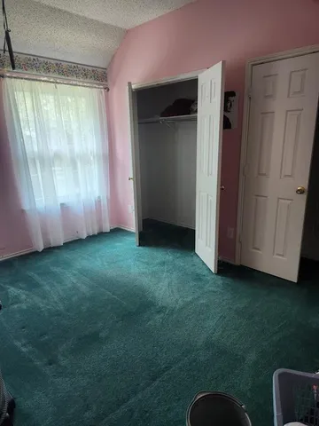 a bathroom with a double vanity sink a mirror and a bathtub