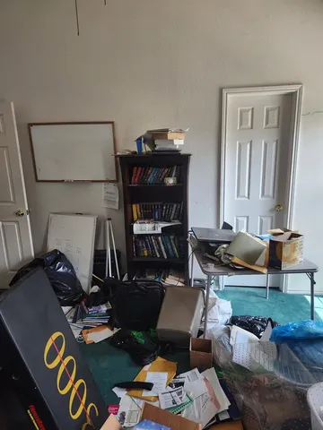 a view of a kitchen with a sink and dishwasher a refrigerator with wooden floor