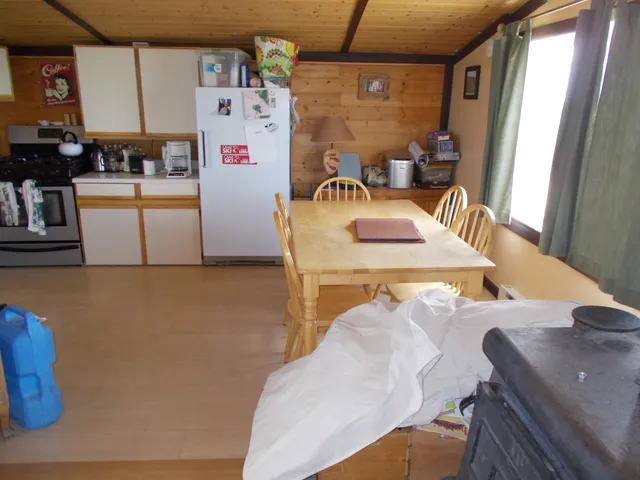 a view of a dining room with furniture and a table