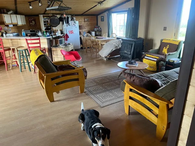 a living room with lots of furniture and a chandelier