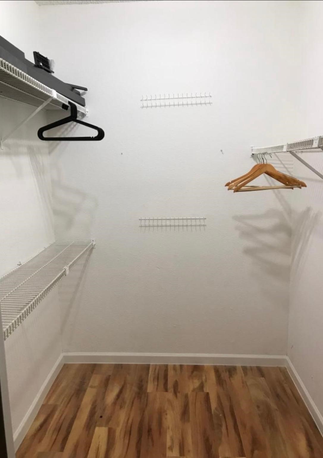 2125 Augusta Drive, Unit 1 Houston, TX 77057 - Photo 11 of 12 a view of small space with racks on the wall