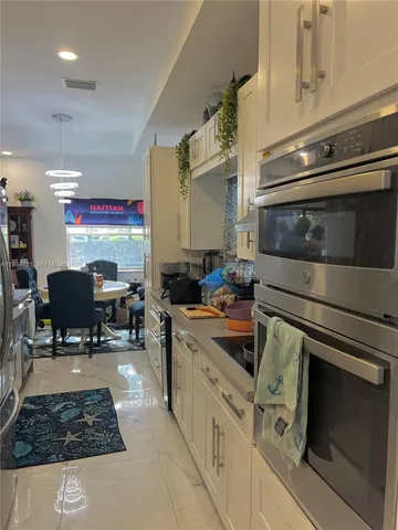a kitchen with a stove and a microwave