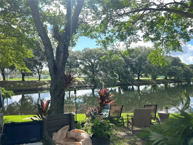 a view of a chairs and fire pit in the patio