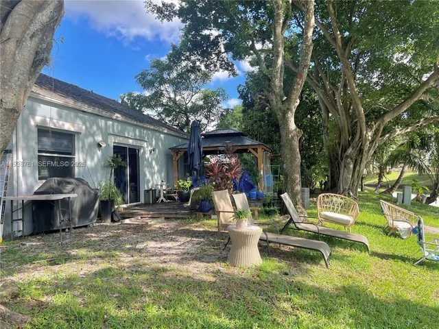a view of a chairs and tables in the patio