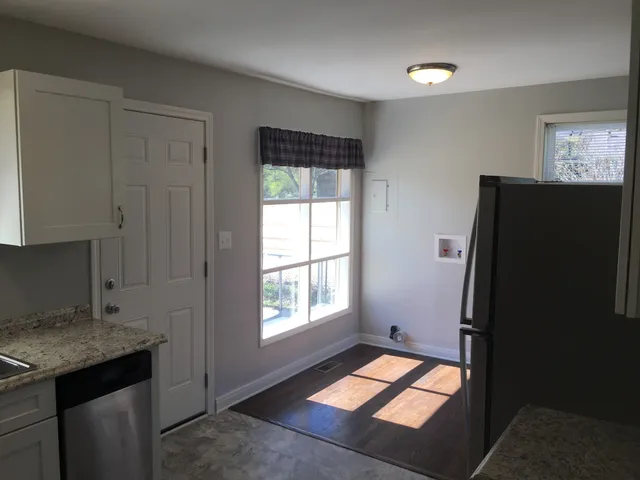 a view of hallway with windows