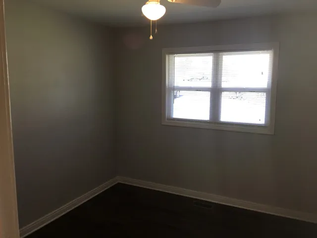 a bathroom with a mirror and a shower