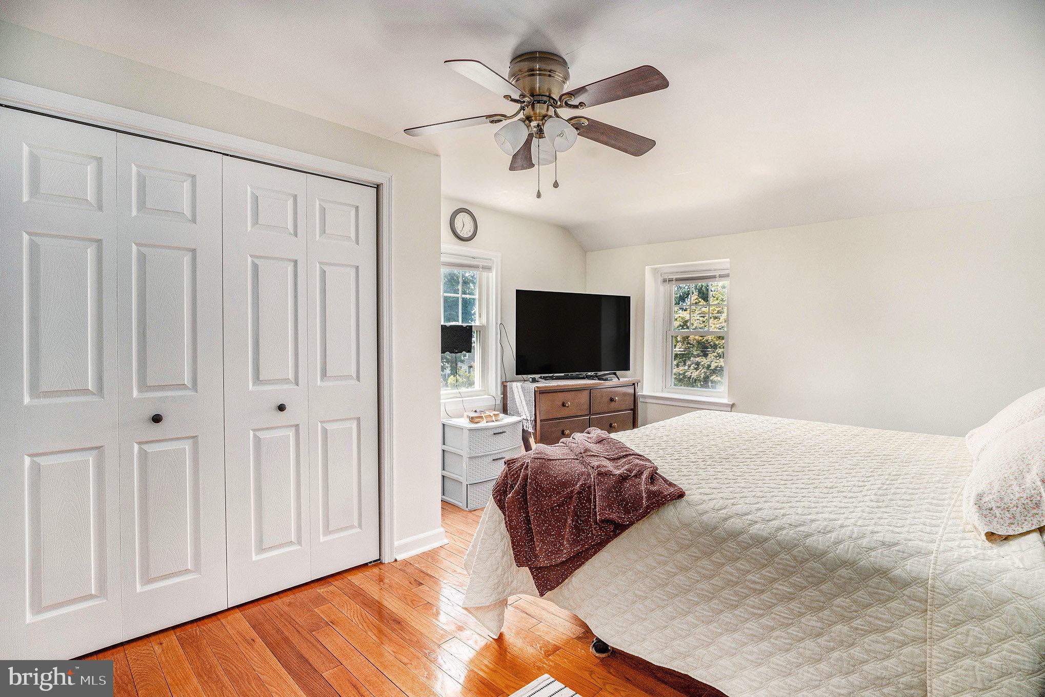 2209 East County Line Road Ardmore, PA 19003 - Photo 14 of 28 a bedroom with a bed and a flat screen tv