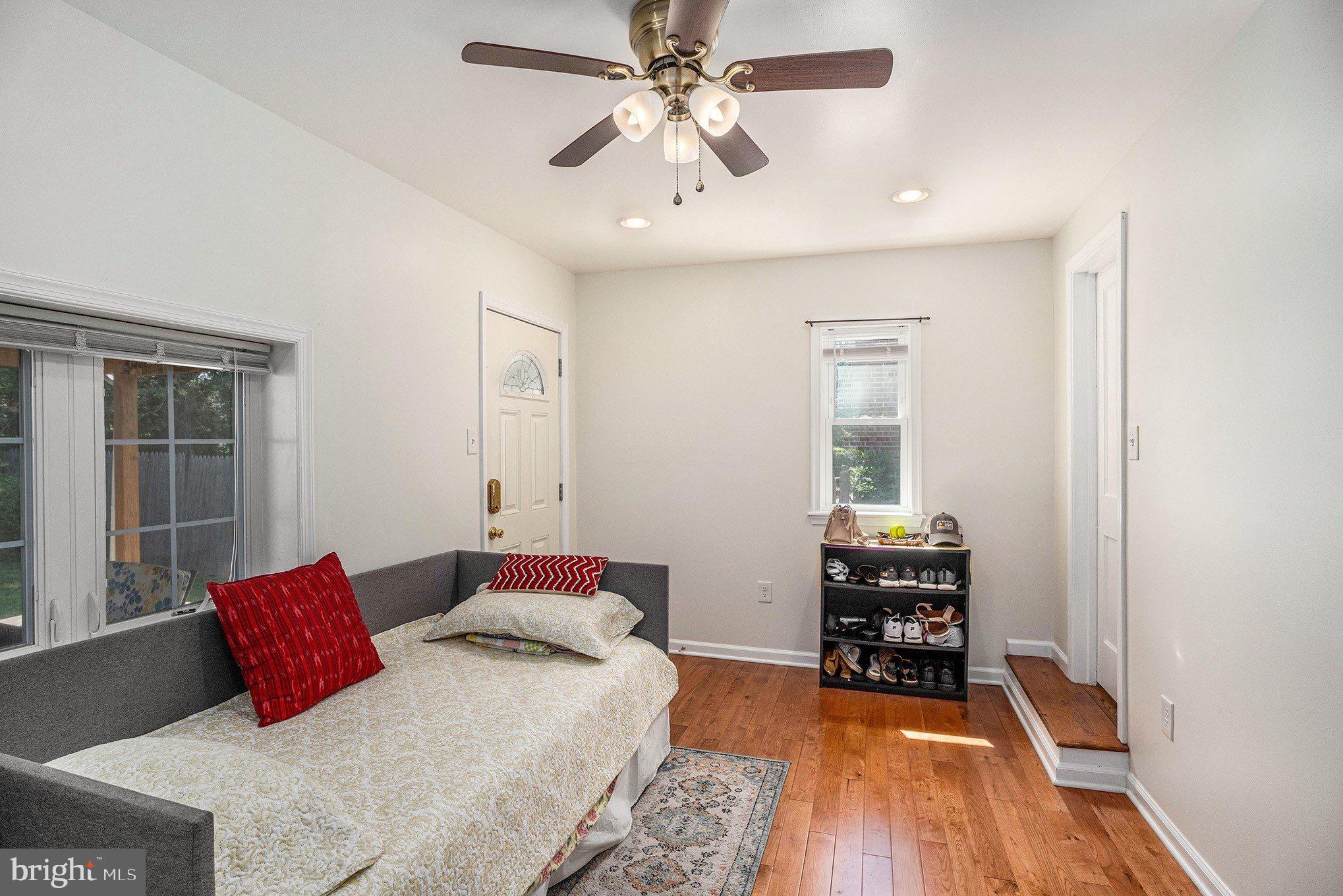 2209 East County Line Road Ardmore, PA 19003 - Photo 19 of 28 a bedroom with a bed and wooden floor
