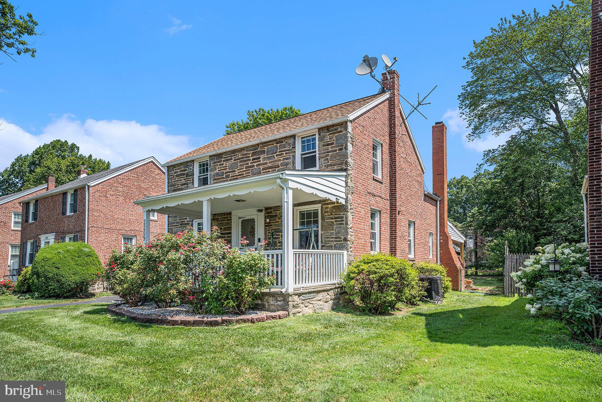 2209 East County Line Road Ardmore, PA 19003 - Photo 2 of 28 a front view of a house with a yard