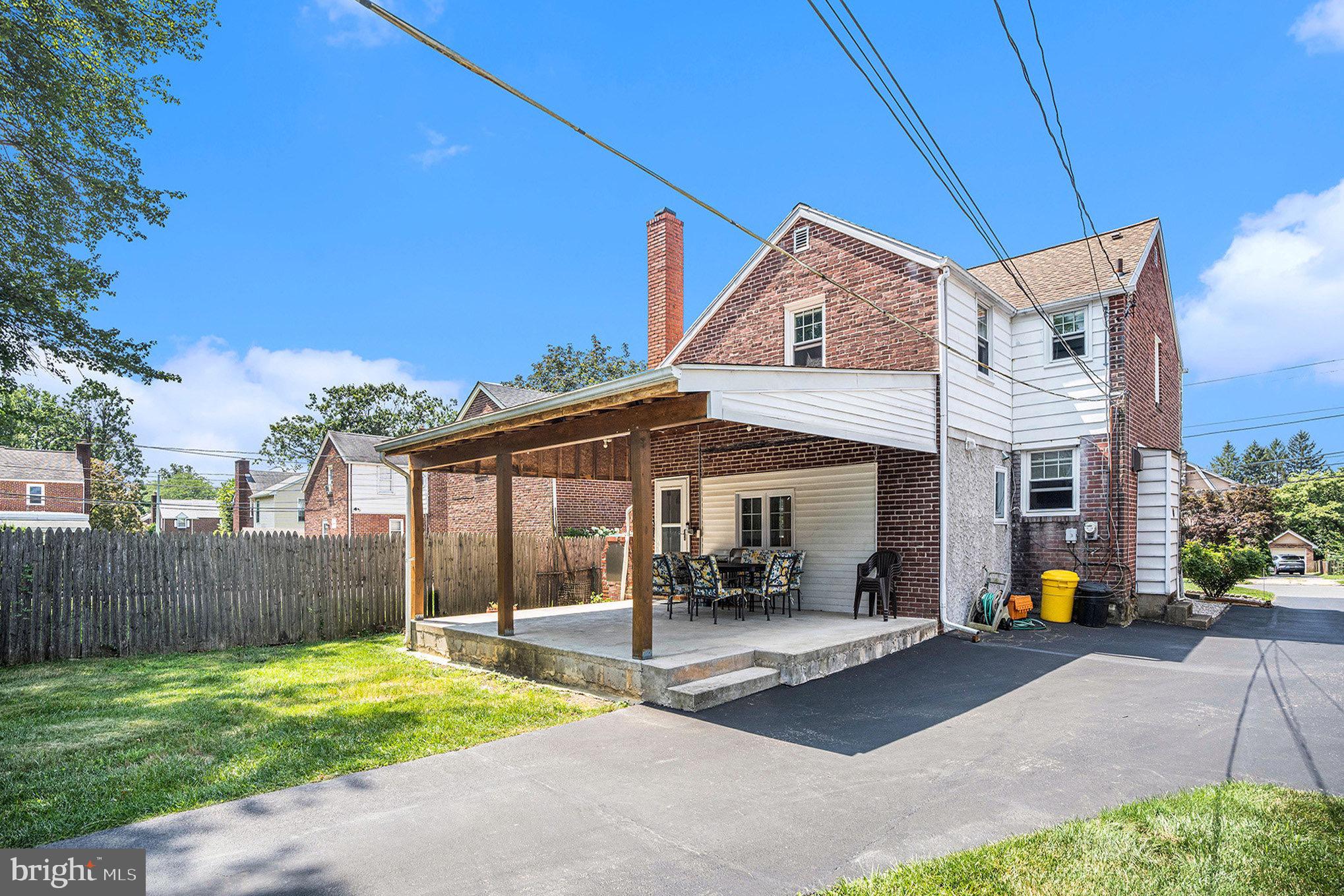 2209 East County Line Road Ardmore, PA 19003 - Photo 26 of 28 a view of a house with a patio