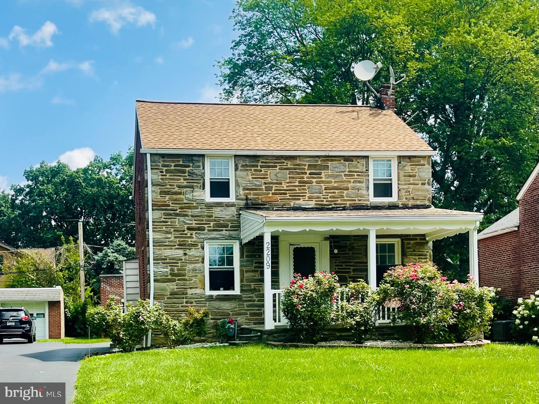 2209 East County Line Road Ardmore, PA 19003 - Photo 4 of 28 front view of house with a yard