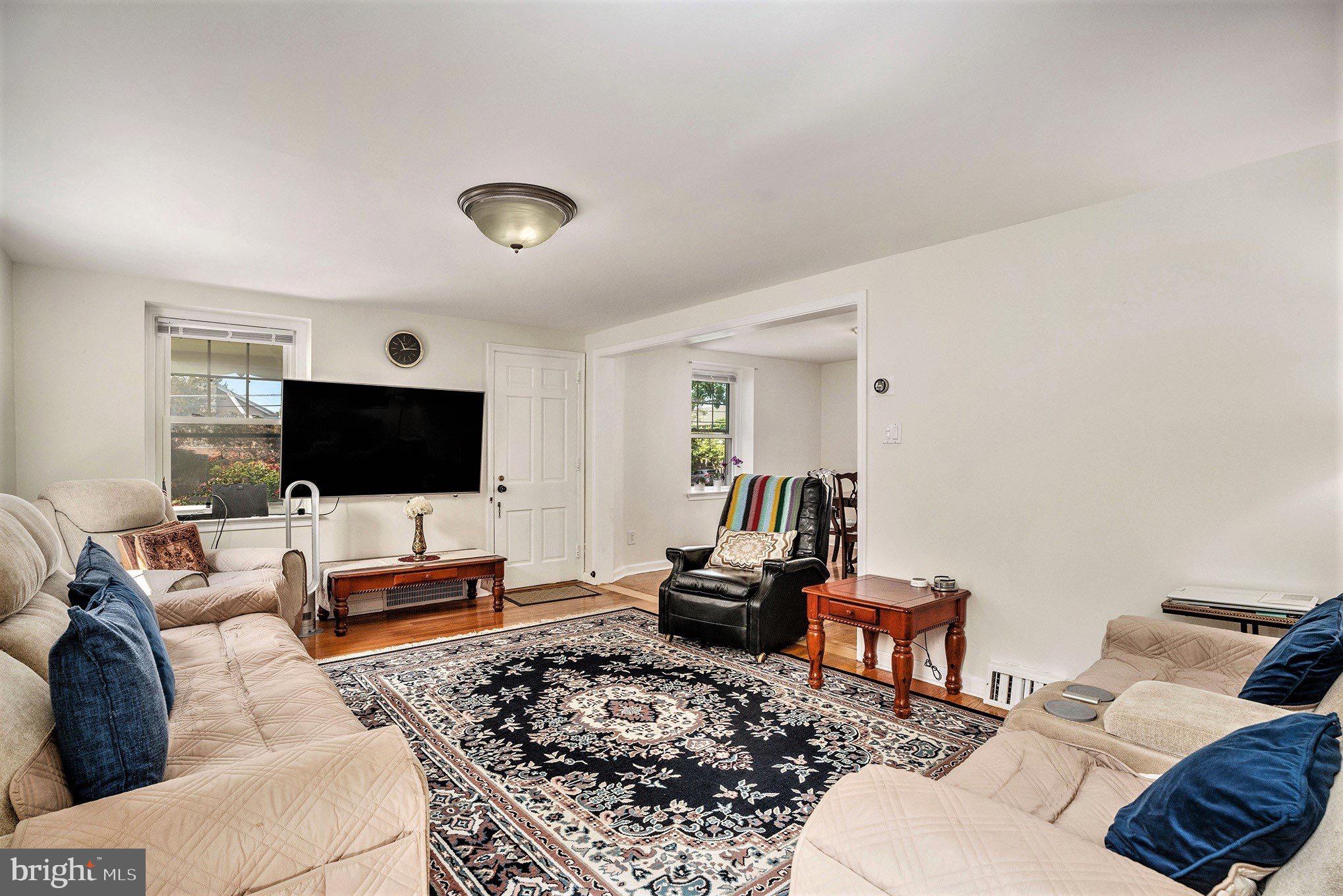 2209 East County Line Road Ardmore, PA 19003 - Photo 6 of 28 a living room with furniture and a flat screen tv