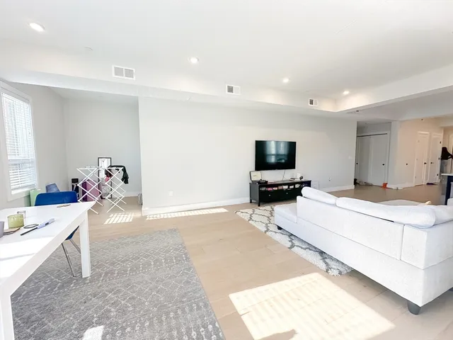 a living room with a couch and a flat screen tv
