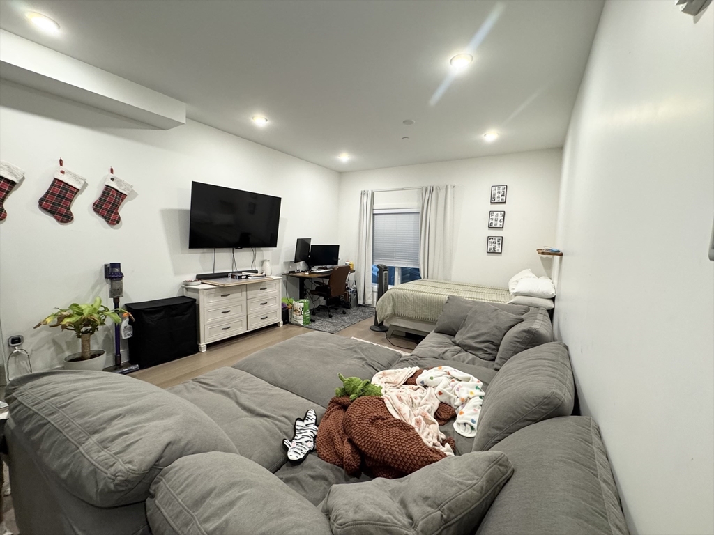 33 Ward Street, Unit 1 Boston, MA 02127 - Photo 5 of 21 a living room with furniture and a flat screen tv