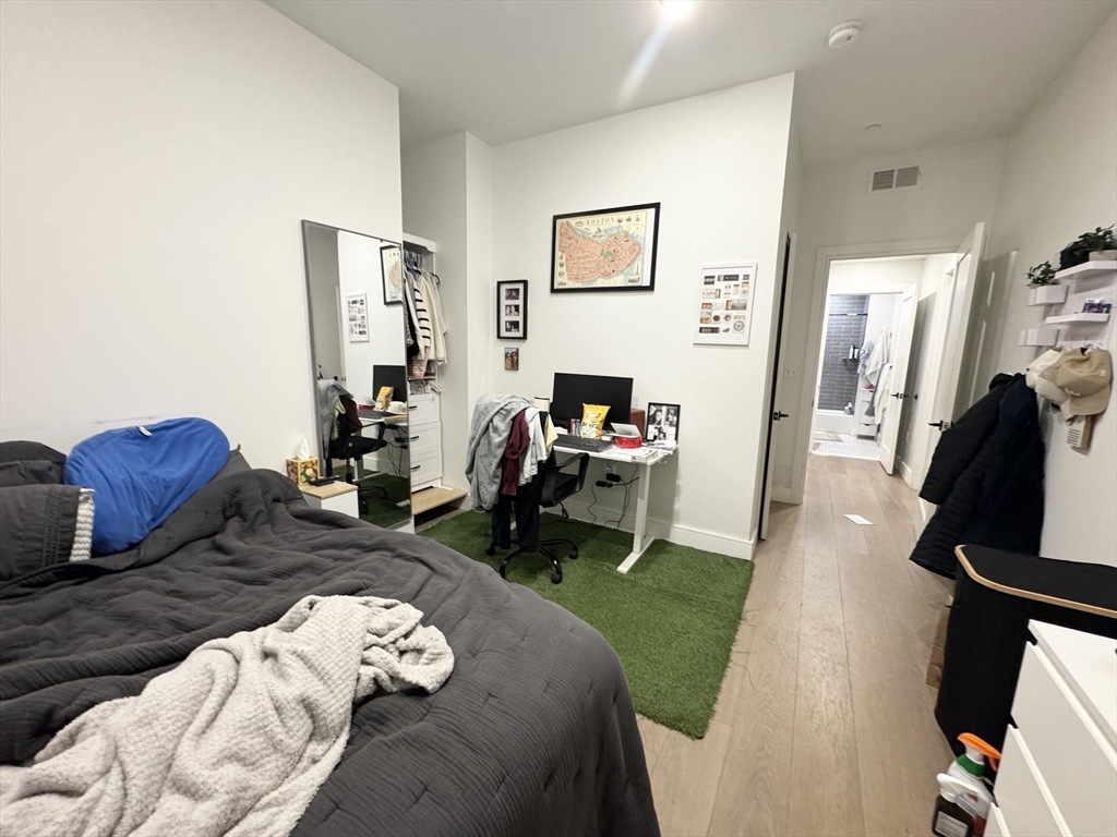 33 Ward Street, Unit 1 Boston, MA 02127 - Photo 7 of 21 a living room with furniture and a flat screen tv