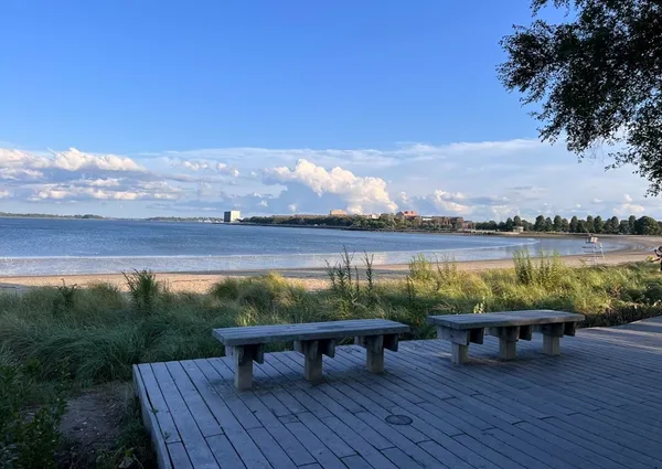 a view of a lake with furniture