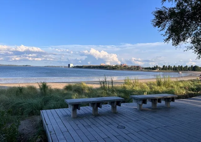 a view of a lake with furniture