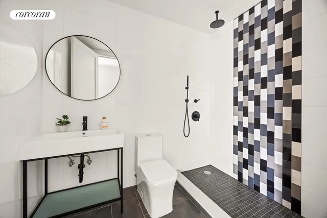 a bedroom with a bed and a potted plant