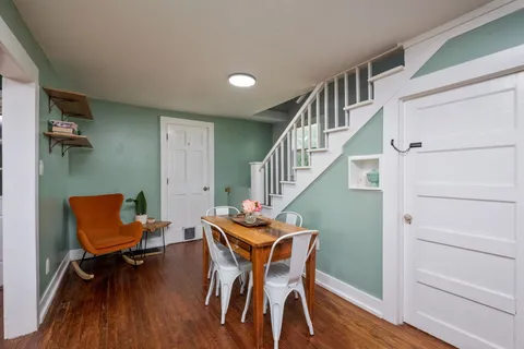 a room with furniture and wooden floor