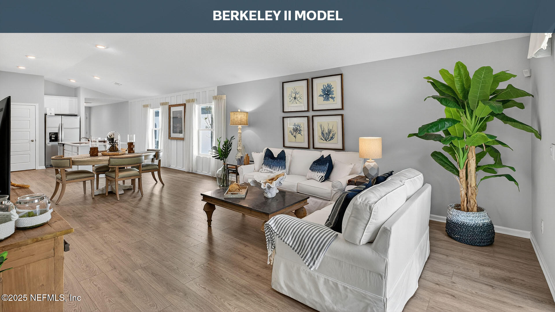 12402 Great Eagle Road Jacksonville, FL 32219 - Photo 12 of 60 a living room with furniture potted plant and a wooden floor