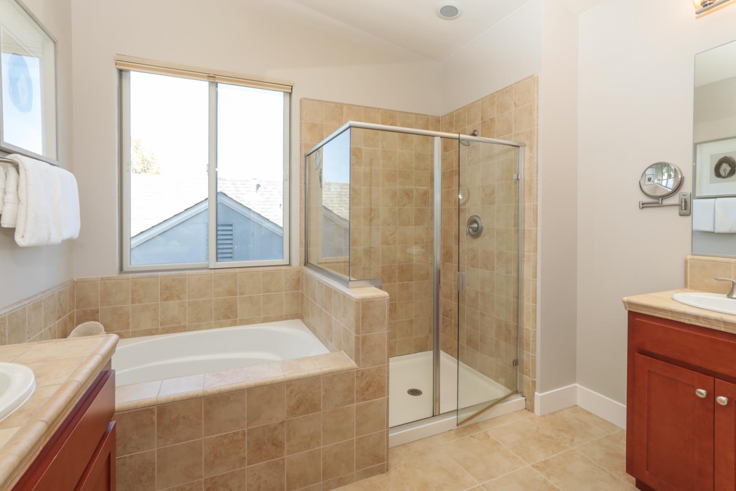 1143 Creek Way Mountain View, CA 94040 - Photo 12 of 24 a bathroom with a bathtub and a shower