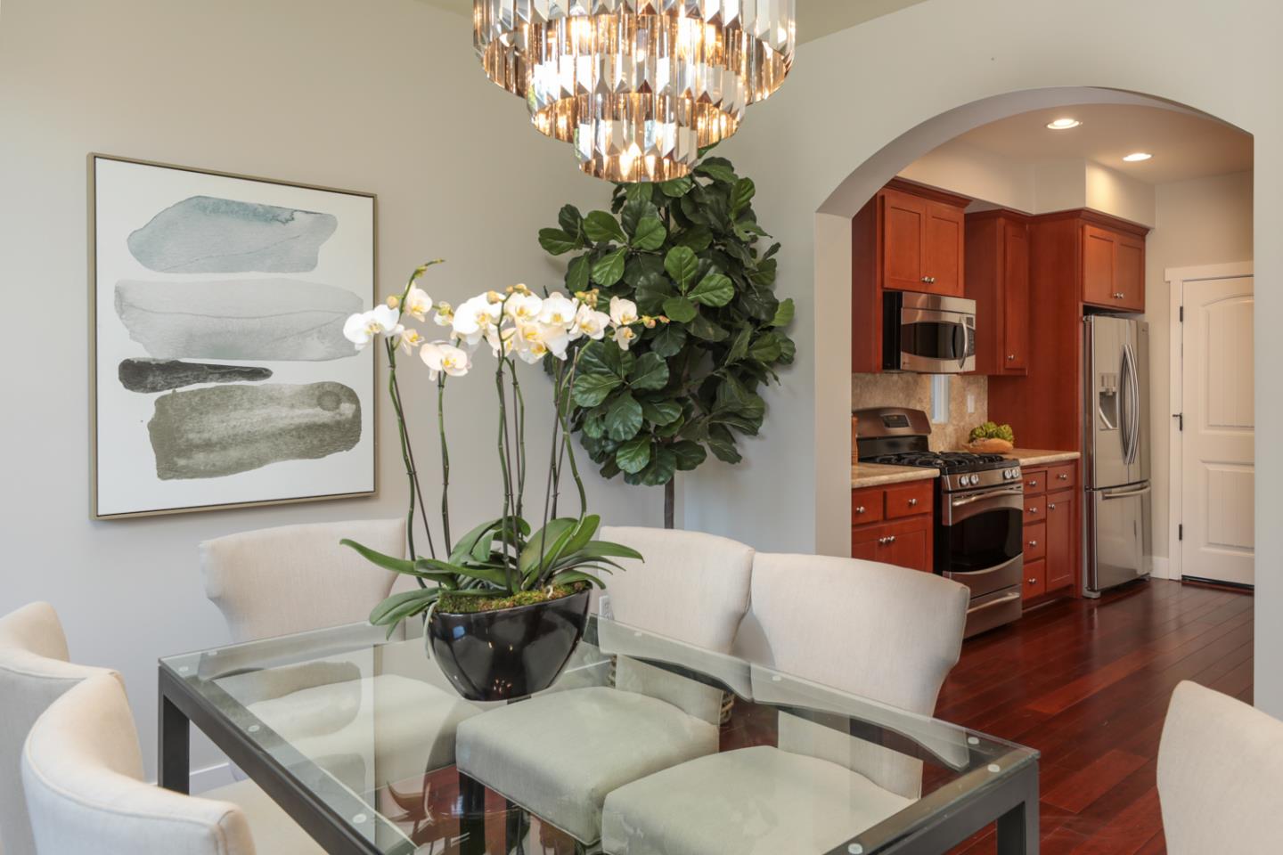 1143 Creek Way Mountain View, CA 94040 - Photo 3 of 24 a living room with furniture potted plant and a chandelier