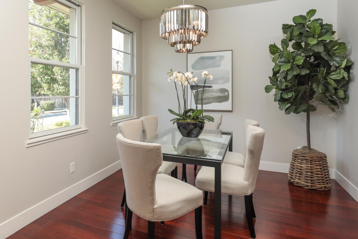 1143 Creek Way Mountain View, CA 94040 - Photo 8 of 24 a dining room with furniture a chandelier and wooden floor
