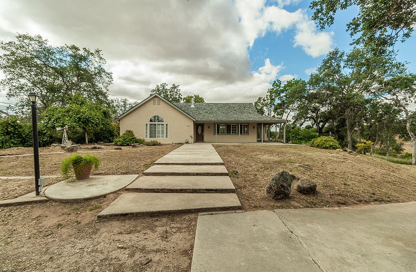 15501 Garlock Lane Prather, CA 93651 - Photo 1 of 47 a white house that has a tree in front of it
